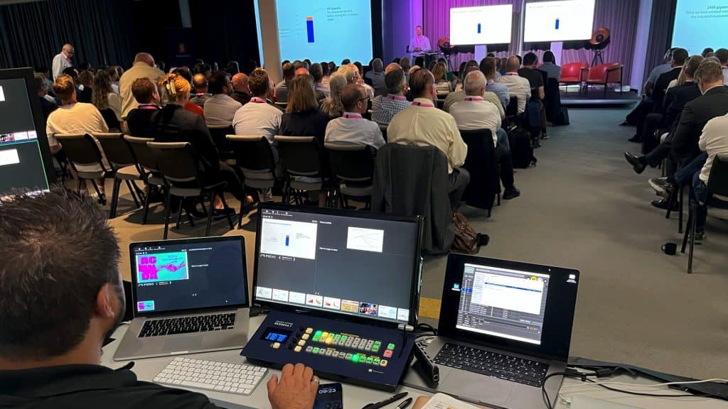 AV technician operating presentations at a live event